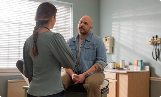 Consoling Man on Bed